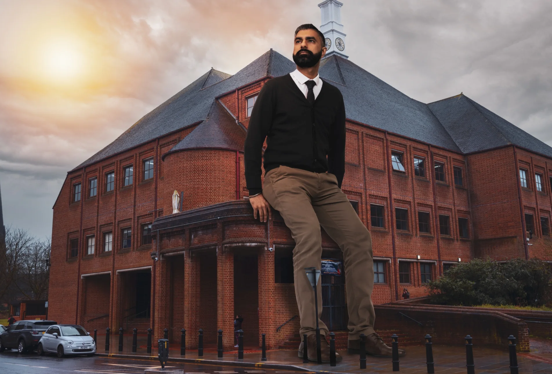 Giant man leans proudly on the Hillingdon County Council building