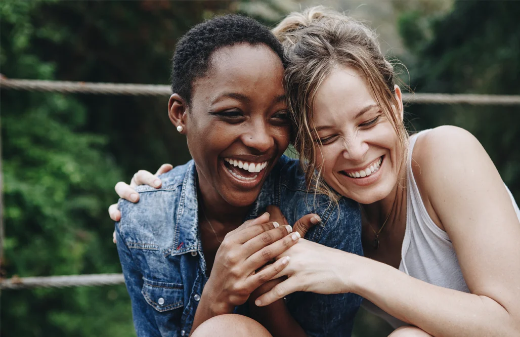 Church of England- Happy friends holding each other