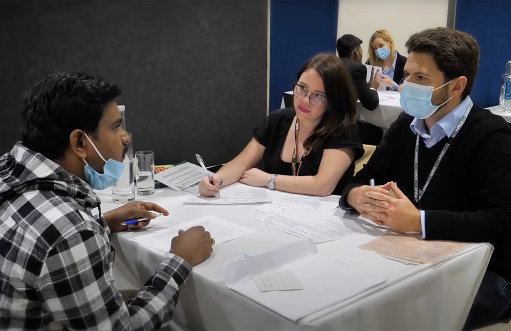 NHS England - man being interviewed by a male and female