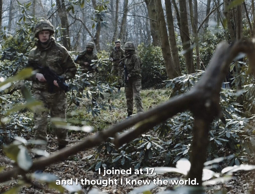 People in army gear in a forest 